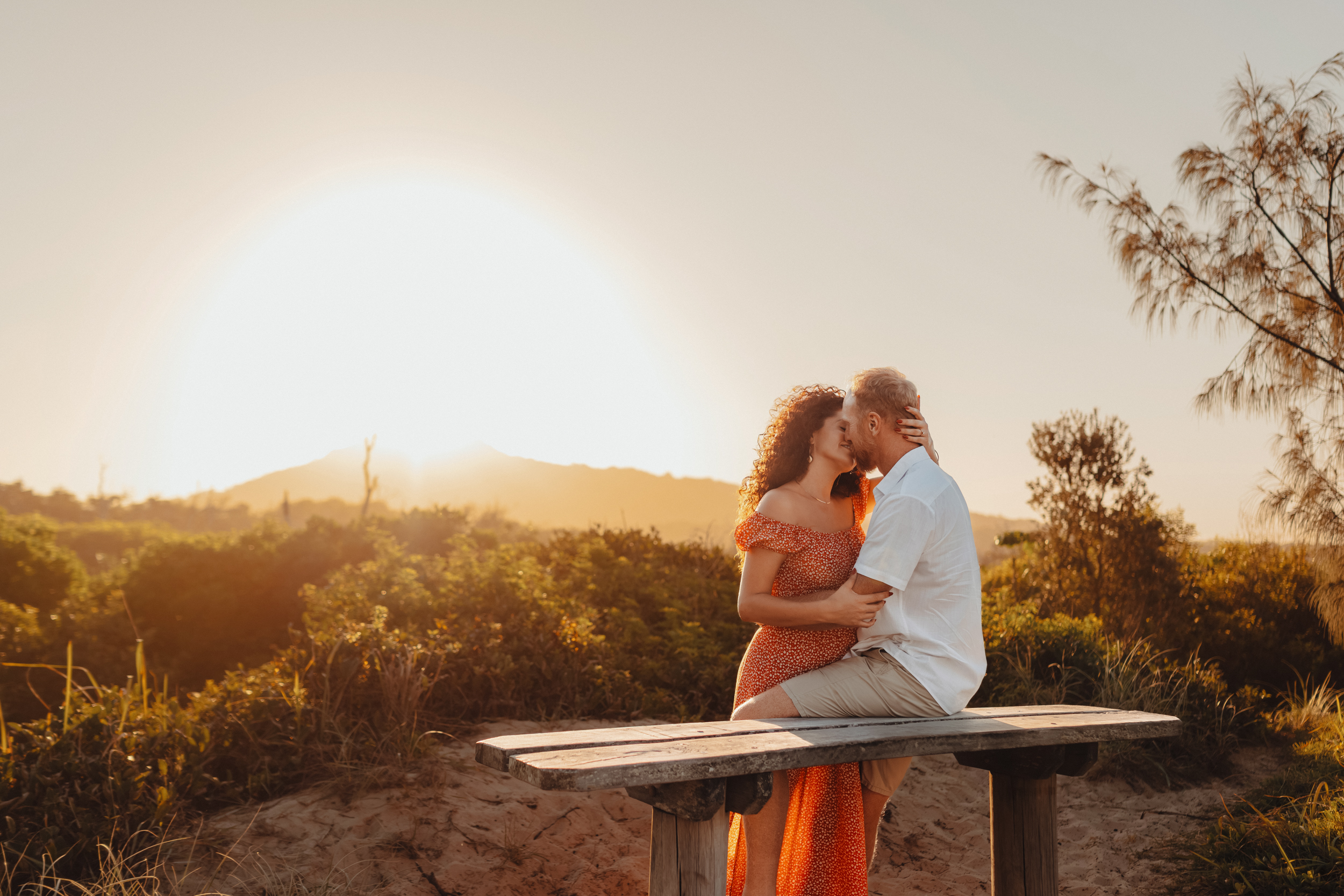Couple on a bench in golden sunset light